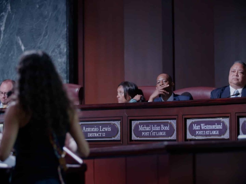 Atlanta City Council Members sitting in Council Chambers listening to a member of the public