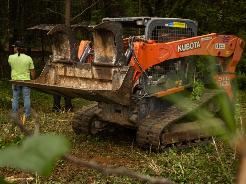 A bulldozer undertaking a clearing of the Weelaunee Forest