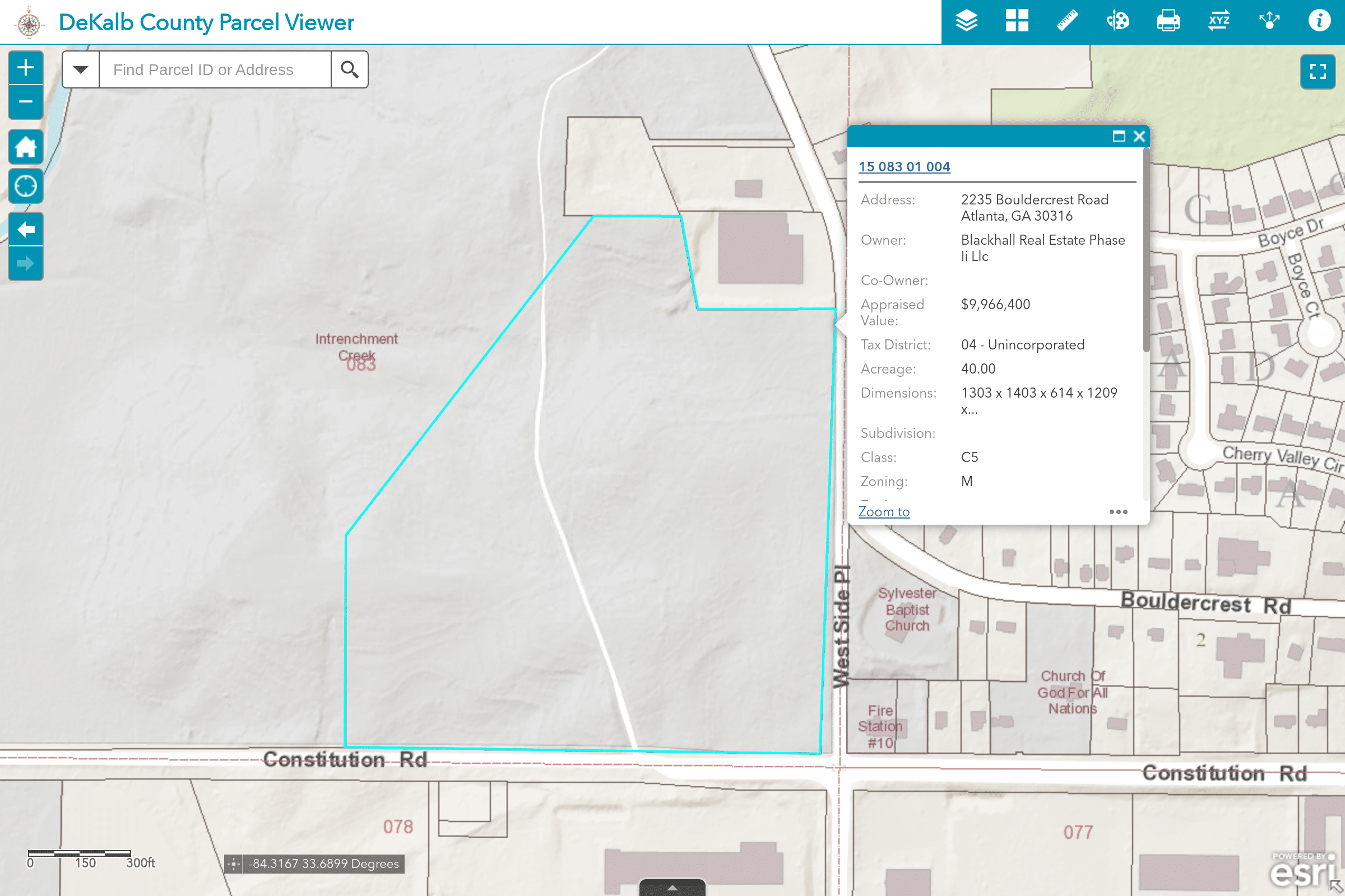 A screenshot from DeKalb County, Georgia's Tax Parcel Viewer application.   Tax parcel 15 083 01 004, also known as the 40 acres of Intrenchment Creek Park involved in the land swap, is highlighted. The following details are also listed for the parcel:
Address:	2235 Bouldercrest Road Atlanta, GA 30316
Owner:	Blackhall Real Estate Phase Ii Llc
Co-Owner:	
Appraised Value:	$9,966,400
Tax District:	04 - Unincorporated
Acreage:	40.00
Dimensions:	1303 x 1403 x 614 x 1209 x...
Subdivision:	
Class:	C5
Zoning:	M