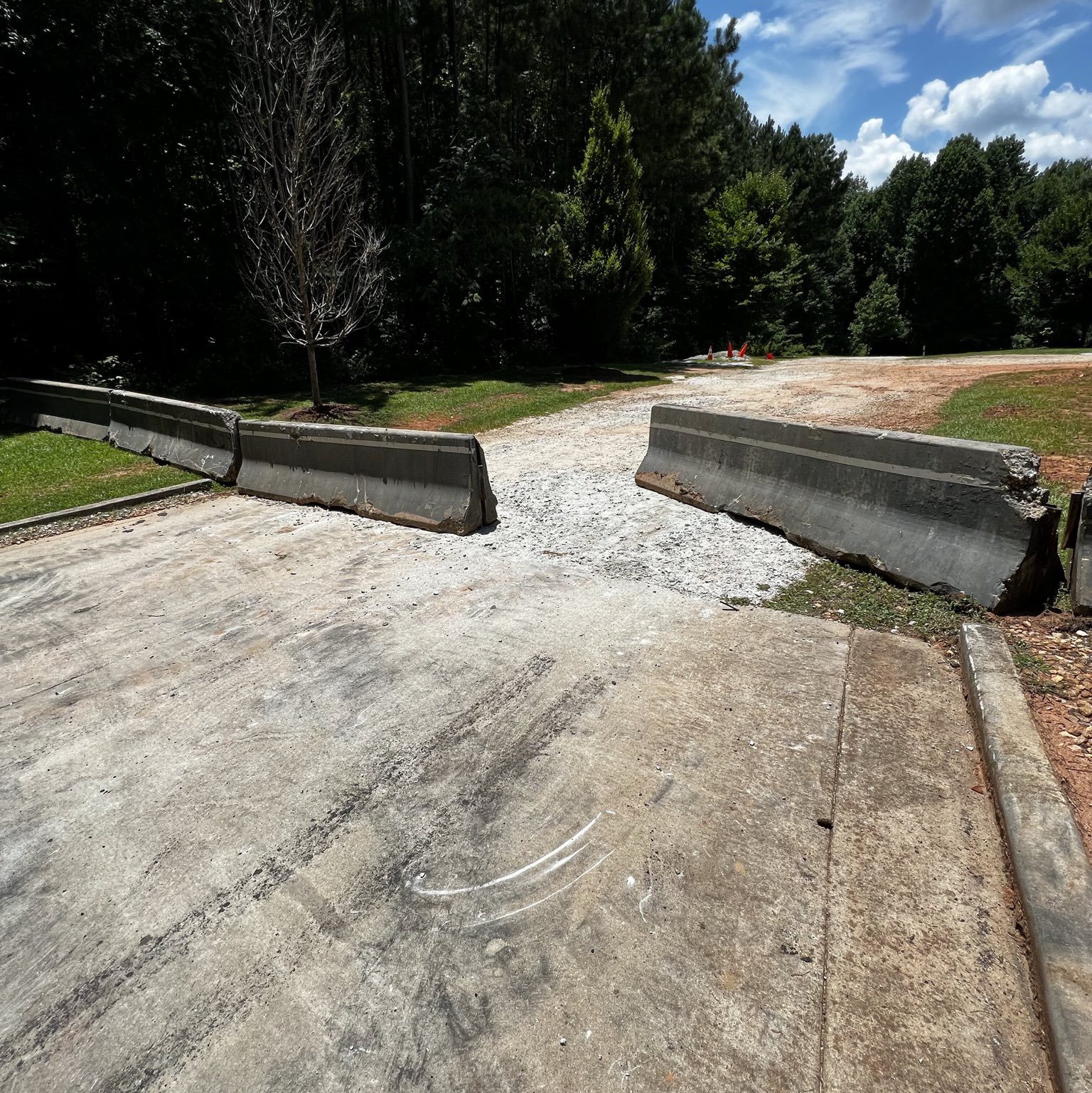 Barricades placed in front of a parking lot with access to Intrenchment Creek Park in DeKalb County, GA.