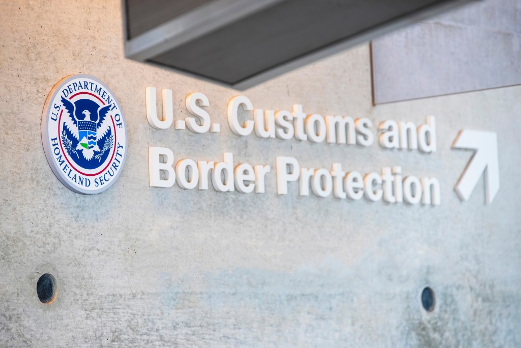 Los Angeles USA A sign for U.S. Customs and Border Protection with the Department of Homeland Security seal displayed on a concrete wall.