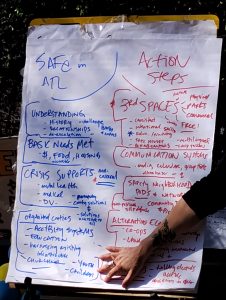 A large sticky note pad showing notes from the People's Movement Assembly in which Atlanta residents redefine public safety. 