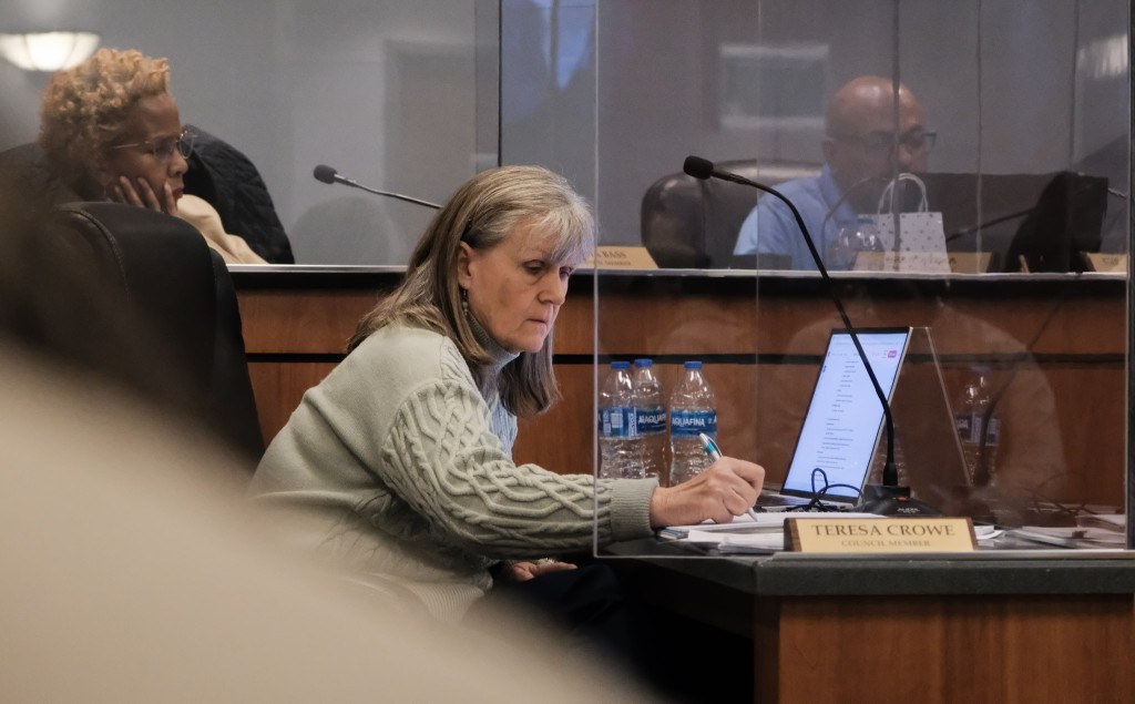 Stone Mountain City Councilmember Teresa Crowe takes notes during a Council meeting.