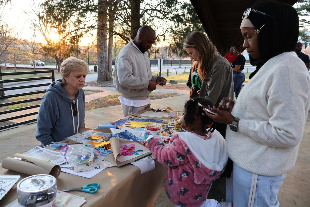 A craft table set up at the Mourning Our Losses event, allowing attendees to add adornment to their remembrances.